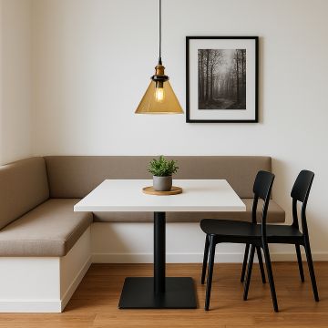 Amber glass pendant light with brass fitting styled over dining table seating area for warm modern home decor.