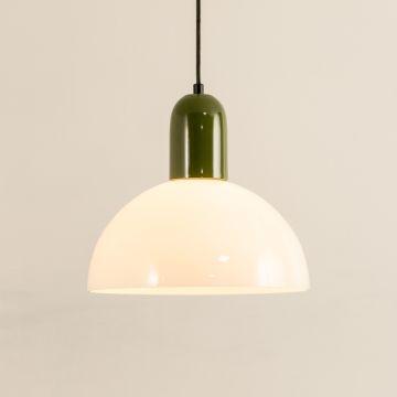 Green and white dome pendant light glowing softly against a clean white background showcasing minimalist modern interior home decor lighting style with smooth finish.