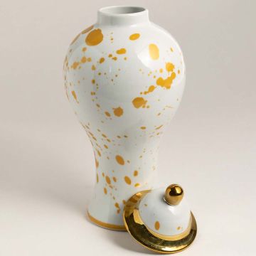 Glossy ceramic jar with golden splatter pattern highlighted on white background showcasing its premium finish.