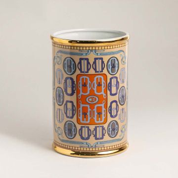 Ceramic holder with orange and blue geometric design and golden rim on white background for elegant interiors.