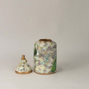 Elegant ceramic jar with golden lid featuring a detailed green peacock illustration perfect for home and office décor.