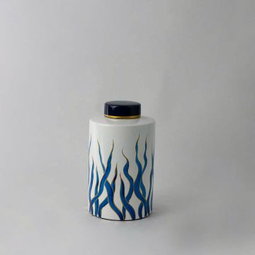 White ceramic jar with blue artistic wave design and golden rim lid perfect for modern luxury home decor styling.