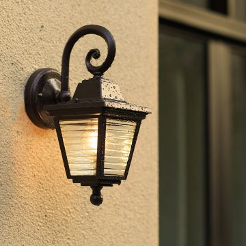 Outdoor lantern light mounted on a wall creating a welcoming and stylish ambiance for the home exterior.
