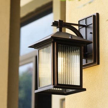 Outdoor wall-mounted lantern light enhancing the exterior decor with warm illumination.