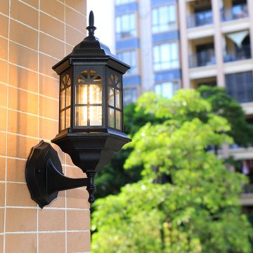 Elegant lantern wall light illuminating a modern balcony enhancing outdoor ambiance with warm glow.