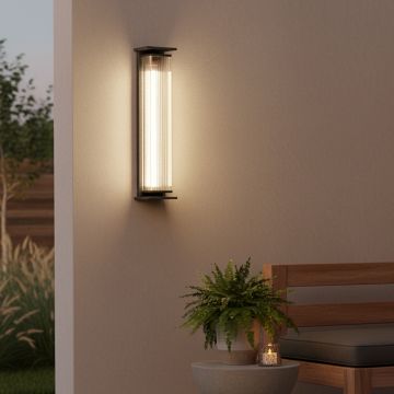 outdoor black steel solar wall sconce with clear lucite shade main lifestyle