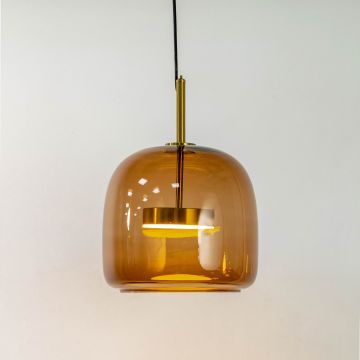 Gold and amber glass pendant light glowing softly against a white background showcasing its sleek design and modern elegance.
