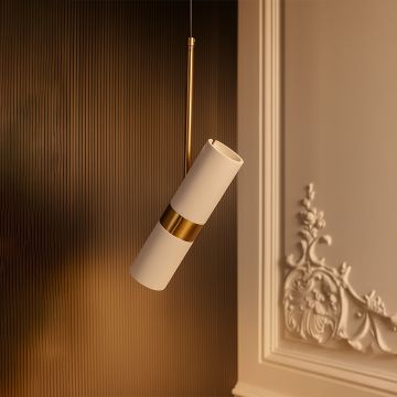 Modern white and gold cylindrical pendant light hanging in luxury interior elegant ceiling lamp for bedroom and living spaces.