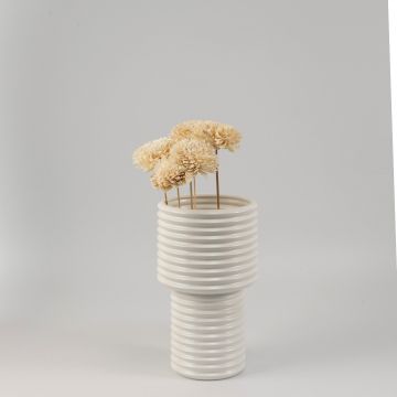 Cream sola flower sticks in a ribbed ceramic vase with artificial decorative flowers for modern home and office decor.