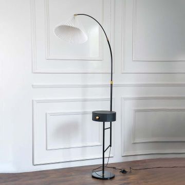The elegant black base floor lamp with a white pleated shade turned off shown on a plain white background highlighting its minimalist design.