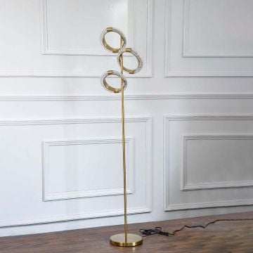 A simple image of the elegant floor lamp with a gold-toned globe shade and black base turned off set against a clean white background emphasizing its minimalist design.