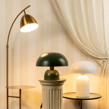 Modern setup featuring a gold floor lamp green dome table lamp and white dome table lamp creating a warm and elegant lighting arrangement.