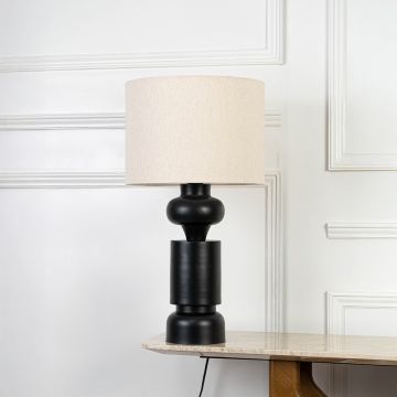 Green ceramic table lamp with beige fabric shade shown on a white background for clear product view.