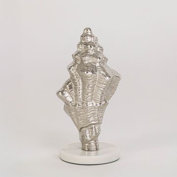 Textured silver conch shell decor on round white base clearly displayed against plain white background for showcase