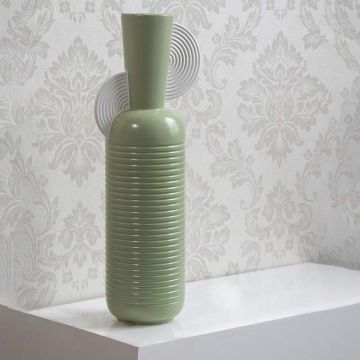 Mint green ribbed decorative vase styled in a minimal interior scene adding soft modern elegance to home decor.