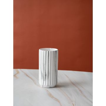 A marble textured cylindrical vase shown on a clean white background highlighting its soft grey pattern and smooth vertical grooves.