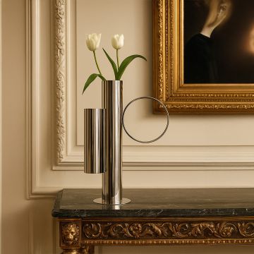 Elegant metal vase with tulips placed on a luxury console table enhancing the classic interior with metallic charm.