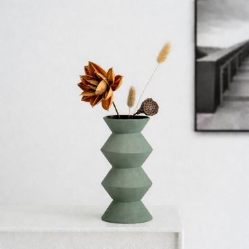 Green ceramic geometric decorative vase with modern sculpted design perfect for dried flower display on console table shelf and home decor.