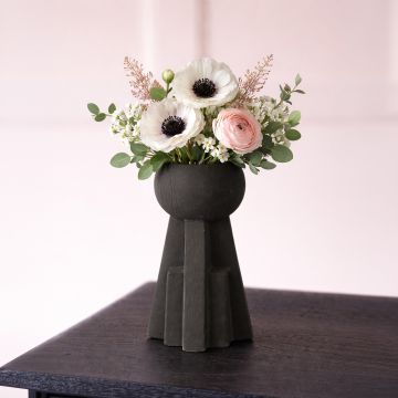 Black ceramic sculptural decorative vase with modern geometric base perfect for dried flower display on console table and stylish home decor.