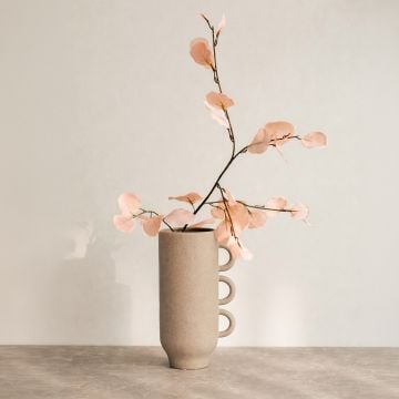 Beige ceramic decorative vase with triple handle design perfect for dried flower display on console table and modern home decor.