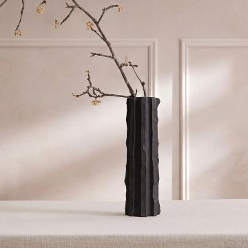 Black ceramic decorative floor vase with tall sculpted fluted design perfect for dried flower display in living room corner and modern home decor.