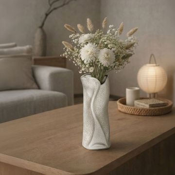 White ceramic decorative floor vase with sculpted wave design perfect for dried flower display in living room corner and modern home decor.