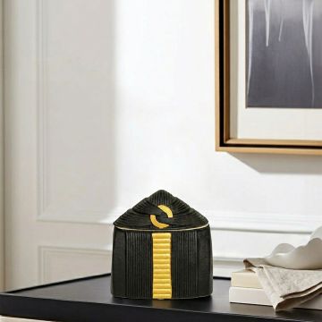 Black ceramic decorative storage jar with gold accent lid perfect for jewelry storage on vanity table and modern home decor.