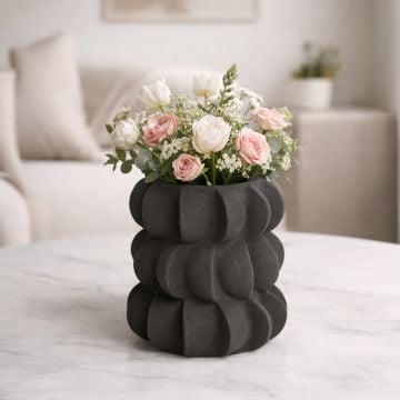 Black ceramic decorative flower vase with sculpted bubble design perfect for dried flower display on console table and modern home decor.