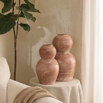 Rustic pink textured decorative vase arranged in a designed home setting adding sculptural artistic decor to living rooms entryways and styled spaces.