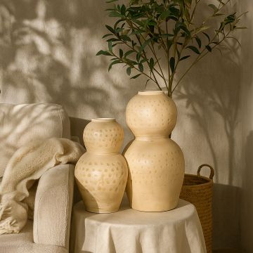 Cream textured decorative vase arranged in a curated home setting enhancing living rooms entryways and styled corners with artistic decor accents.
