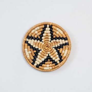 Round bamboo wall plate in black beige and brown woven pattern perfect for boho rustic wall decoration styling.