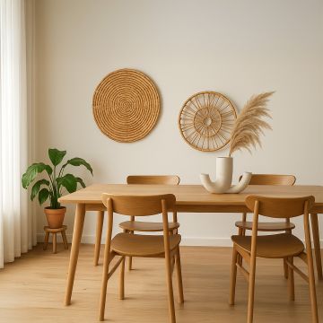 Wicker wall decor plate styled above a neutral sofa in modern living room interior.
