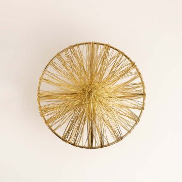 Metallic golden wire art piece with intricate circular design displayed on white background for luxury interiors.