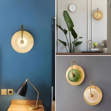 Modern black and gold cylindrical pendant light hanging beside bed elegant bedroom ceiling lamp for luxury home interiors.