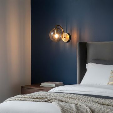 modern globe brass wall light grey main lifestyle