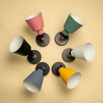 Set of modern wooden wall sconces with colorful conical lampshades black white pink blue yellow and green for bedroom living room and hallway decor.
