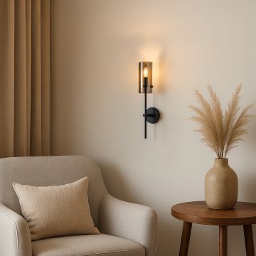 A sleek modern black wall light with a glass shade softly glowing beside the bed enhancing the cozy ambiance of the bedroom with elegant stylish decor.