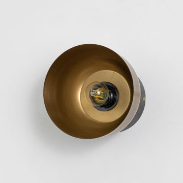 Sleek black and gold metal wall sconce with oval shape on white background for product clarity.