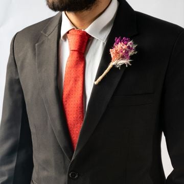 Fuscia Boutonniere Black background