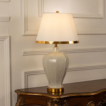 Jacoby Ceramic Table Lamp with White Shade Light On White Background