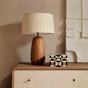 Cream pleated lampshade displayed on a clean white background showing its soft fabric folds and classic shape for a refined lighting accent.