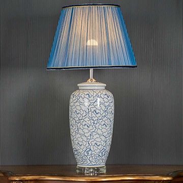 Modern Nordic Style White Ceramic Table Lamp with Blue Shade Light On Black Background