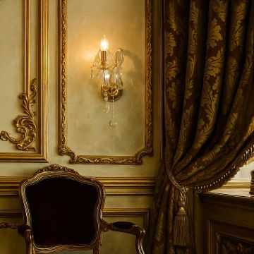 Crystal wall light with golden base glowing in luxury classic interior beside ornate chair and heavy curtain.