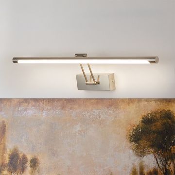 Lifestyle closeup of silver picture light showing fine metal detailing and adjustable arm for precise picture illumination.