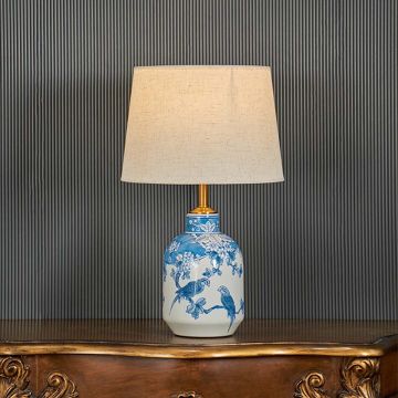The Beauty of Symbolism White & Blue Ceramic Table Lamp Light On Black Background