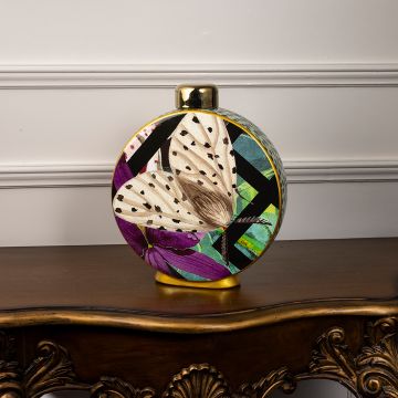 Butterfly ceramic vase on a white background showcasing its colorful abstract butterfly design and golden top accent.