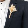 Dried flower boutonniere with beige stems and rustic jute wrap displayed on black background elegant wedding accessory.