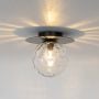 Black ceiling light with glowing textured glass globe and round base displayed on white background for modern lighting.