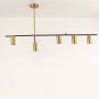 Gold linear chandelier displayed on white background with light off showcasing clean lines and premium black and gold finish.