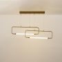 Gold geometric ceiling fixture with layered LED rectangular bars offering modern sculptural illumination ideal for stylish dining and living room spaces.